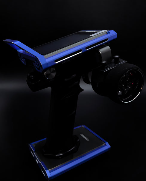 Robotic arm with a smartphone on a dark background