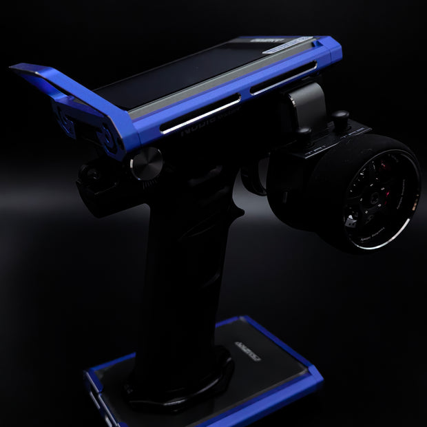Robotic arm with a smartphone on a dark background
