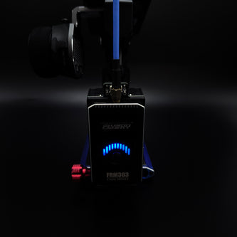 Black electronic device with blue LED lights on a dark background
