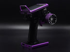 Black and purple fishing reel stand on a dark background
